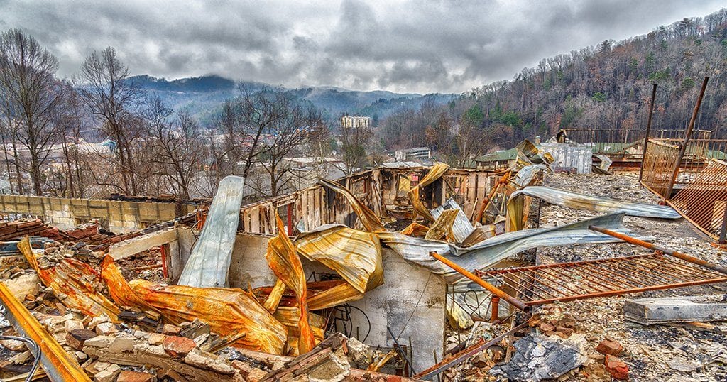 A motel complex lies in ruins after a major forest fire roared through Gatlinburg and a large section of the Smoky Mountains in late December 2016 (Carolyn Franks / Shutterstock.com)