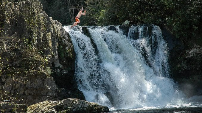 Abrams Falls Abrams Falls makes for a beautiful photo-op, but it's a dangerous place to try and enter the water (don't do what this guy is doing) (stock photo/TheSmokies.com)