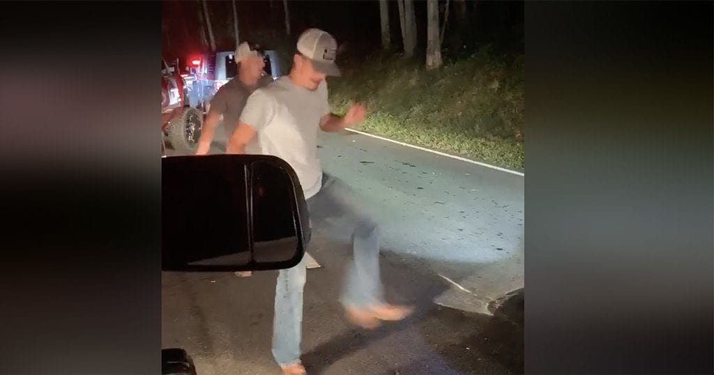 Dylan Woods and Josh Fugate line dance to "The Git Up" by Blanco Brown while stuck in Rod Run traffic at 1am near Gatlinburg